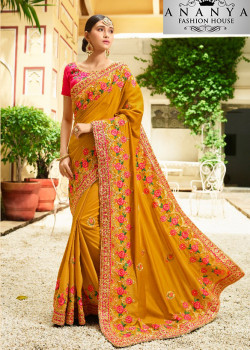 Enigmatic Yellow Georgette Saree with Pink Blouse