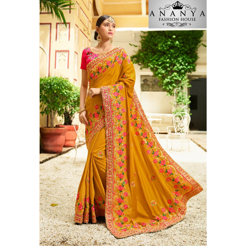 Enigmatic Yellow Georgette Saree with Pink Blouse