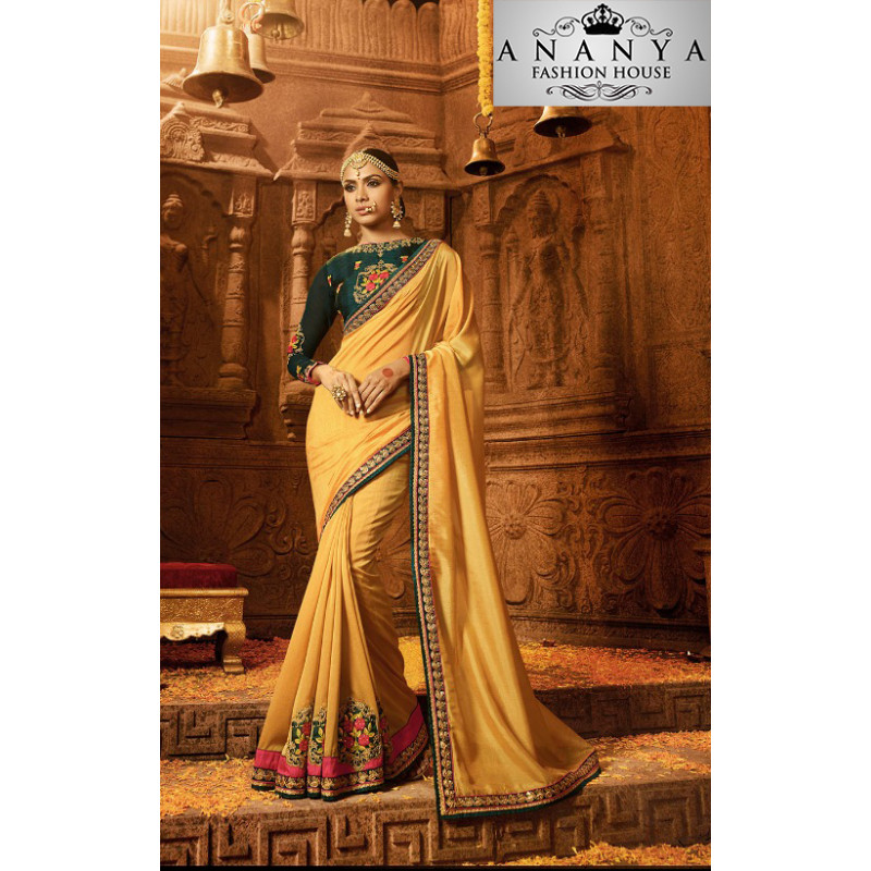 Adorable Yellow Georgette Saree with Dark Green Blouse