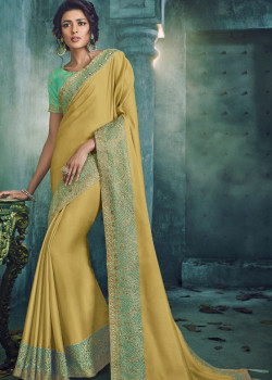 Luscious Yellow Georgette Saree with Blue Blouse