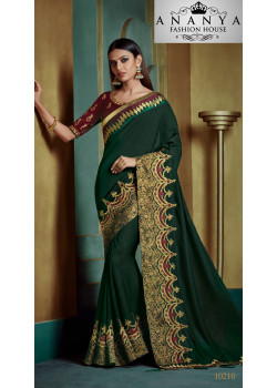 Exotic Dark Green Georgette Saree with Maroon Blouse