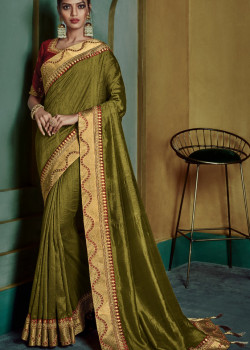 Magnificient Green Georgette Saree with Pink Blouse