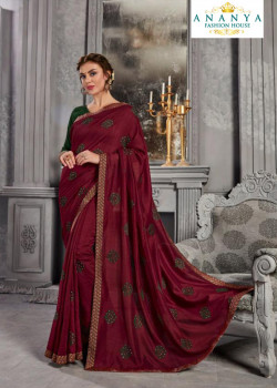 Adorable Wine Silk Saree with Bottle Green Blouse